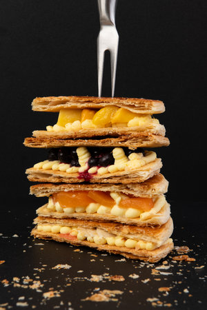 Delicious waffles with fruits on a black background, close-upの写真素材