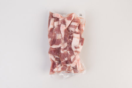 Raw pork meat in plastic bag isolated on white background, top viewの写真素材
