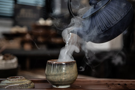 tea ceremony, teapot and teacup with smokeの写真素材