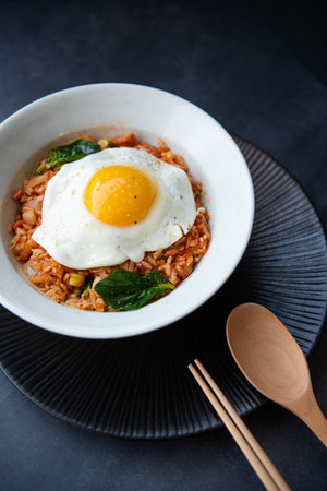 Korean food stir-fried rice with pork and fried egg in a bowlの写真素材