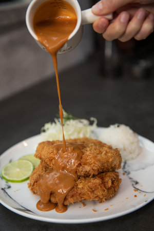 Crispy pork cutlet with sweet sauce.の写真素材