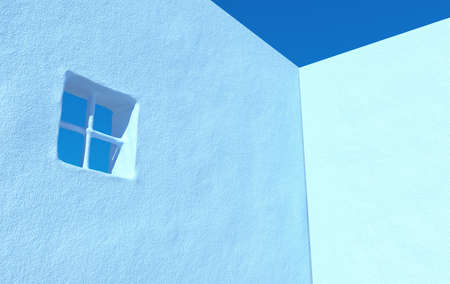 Empty concrete grunge wall. 3d rendering of city house with clear sky background. Detail of house exterior wall with small window. 3d rendering. Blue colorの写真素材