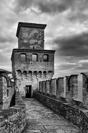 walkway towards the keep patrol through the battlements of the village of Vigolenoの写真素材