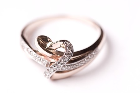 Gold ring with diamonds on the white undergroundの写真素材