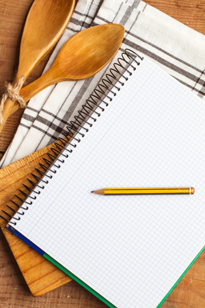 Wooden spoons and kitchen notebookの写真素材