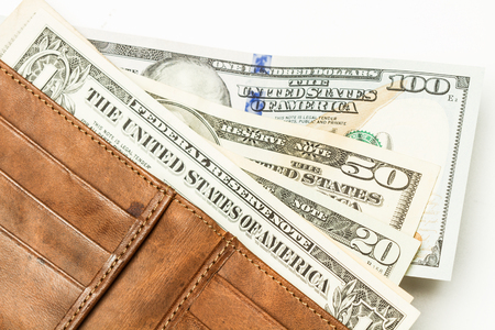 Dollar bills in a wallet
