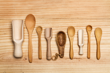 Wooden spoons on a wooden tableの写真素材