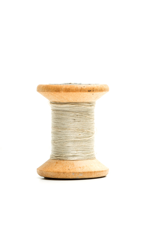 Old thread spools in a cut out view