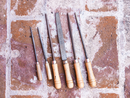 Wood rasps on brick floorの写真素材