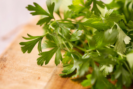 Parsley on a wooden tableの写真素材