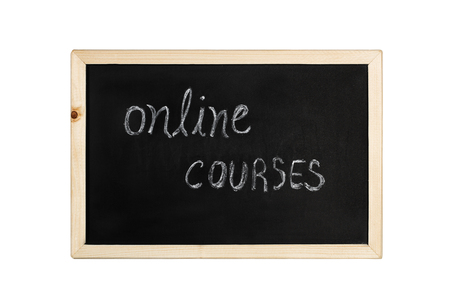 A blackboard with online courses in chalkの写真素材