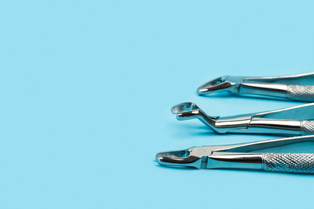 Dental instruments for dentist on a light blue backgroundの写真素材