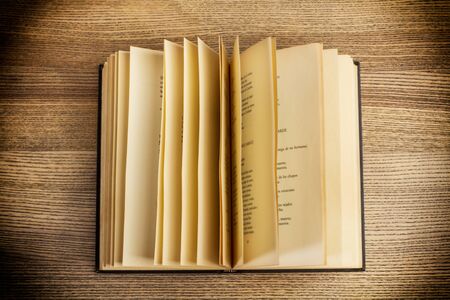 open book on a wooden tableの写真素材