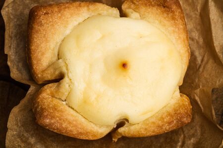 A homemade cheese pie on a wooden tableの写真素材