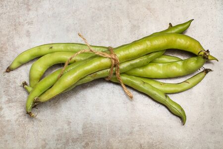Tied Broad Beans on a Marble Tableの写真素材