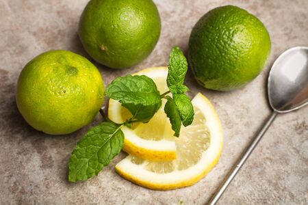 Limes and lemons on a marble board