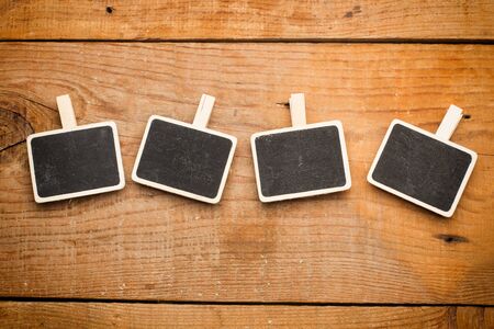 Small blackboards on a wooden table