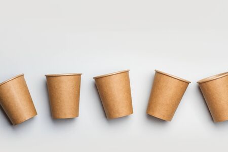 Disposable paper cups on a gray background in a top viewの写真素材