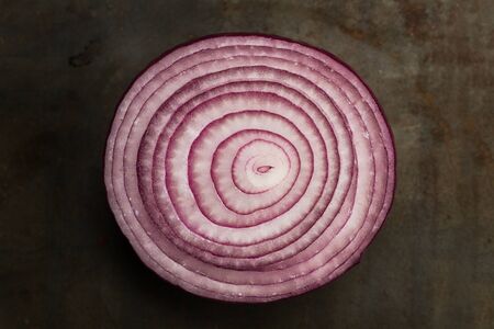 Slice of purple onion in a top viewの写真素材