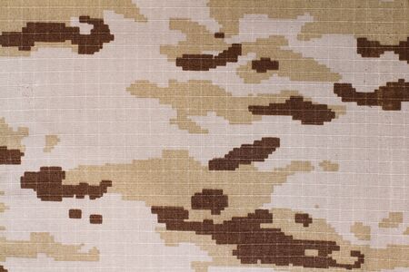 A texture of a pixelated camouflage fabric