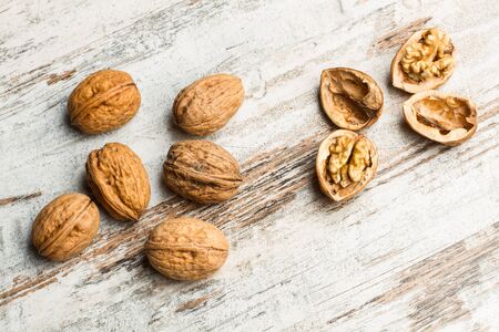 Open and close walnuts on a rustic woden table