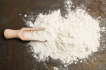 Flour and a wooden spoonの写真素材
