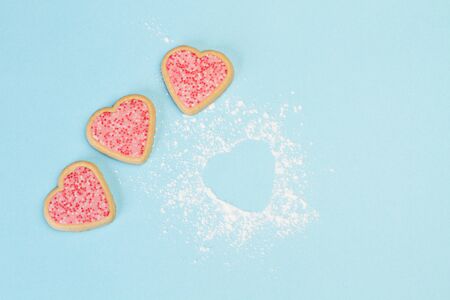 Heart shape cookies on a light blue background