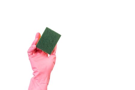 Hand with a pink rubber glove holding a sponge on a white backgroundの写真素材