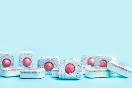 Dishwasher tablets on a light blue backgroundの写真素材
