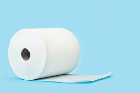 A big roll of paper towels on a blue background