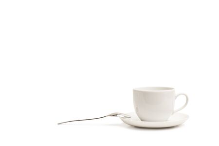 A cup of coffee with a spoon isolated on a white backgroundの写真素材