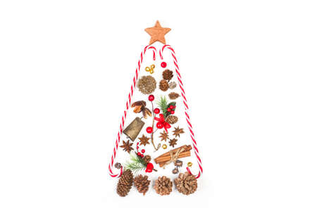 A christmas tree made with christmas ornaments on a white background