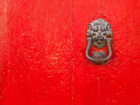 Red door with lion shape door knockerの写真素材