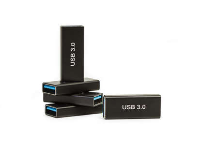 Five portable usb memories on a white background