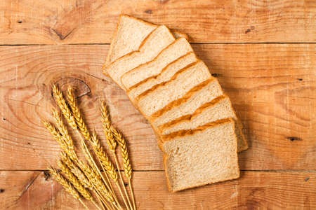 Wholemeal sliced bread on a wooden table