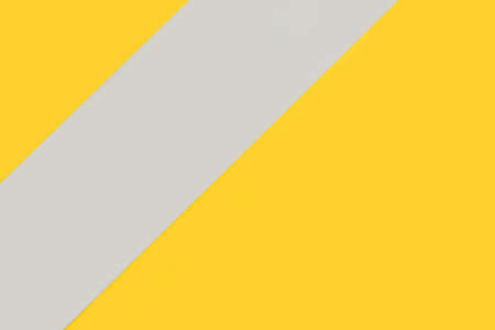 Geometric yellow and gray paper background with copy spaceの写真素材