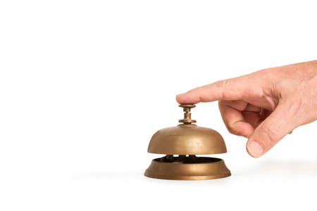 Man hand ringing a reception bell on a white background