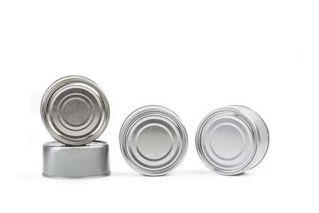 Closed cans of preserves on a white background