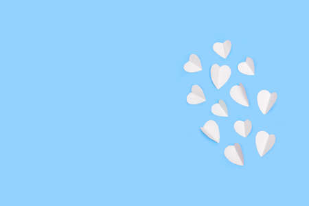 White hearts on a light blue background with copy spaceの写真素材