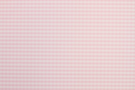 White and pink checkered background in a close up viewの写真素材