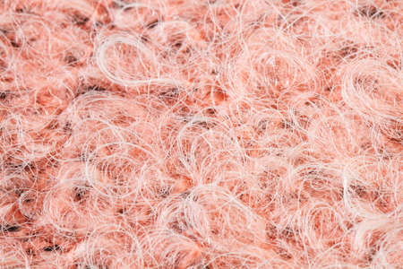 A pink wool cloth texture in a close up view