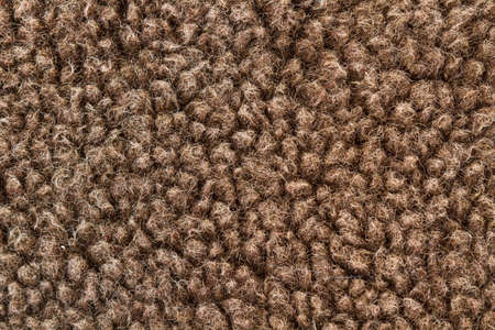 Texture of a brown wool cloth in a close up view