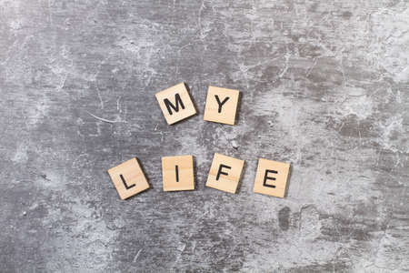 My life phrase written with wooden letter blocks on a stone backgroundの写真素材