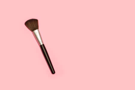 Make up brush on a pink background with copy spaceの写真素材