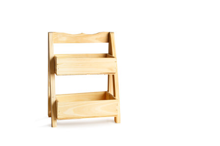 Wooden shelving flower pots shape on a white background with copy spaceの写真素材