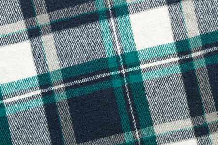 Green, white and gray plaid fabric in a close up view