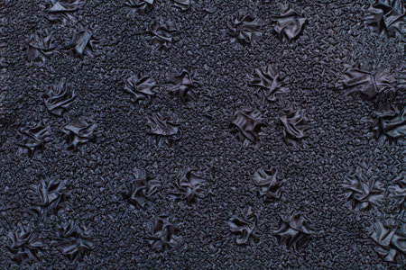 A black fabric texture in a close up viewの写真素材