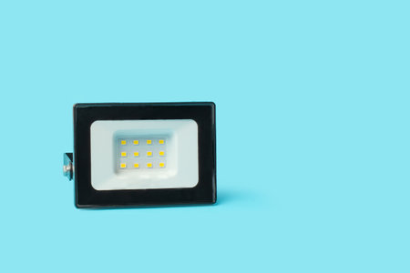 Led reflector on a light blue background with copy spaceの写真素材