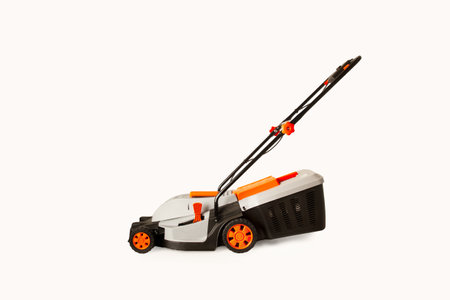 An electric mower on a white background with copy spaceの写真素材