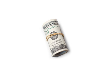 A roll of dollar bills on a white background with copy spaceの写真素材